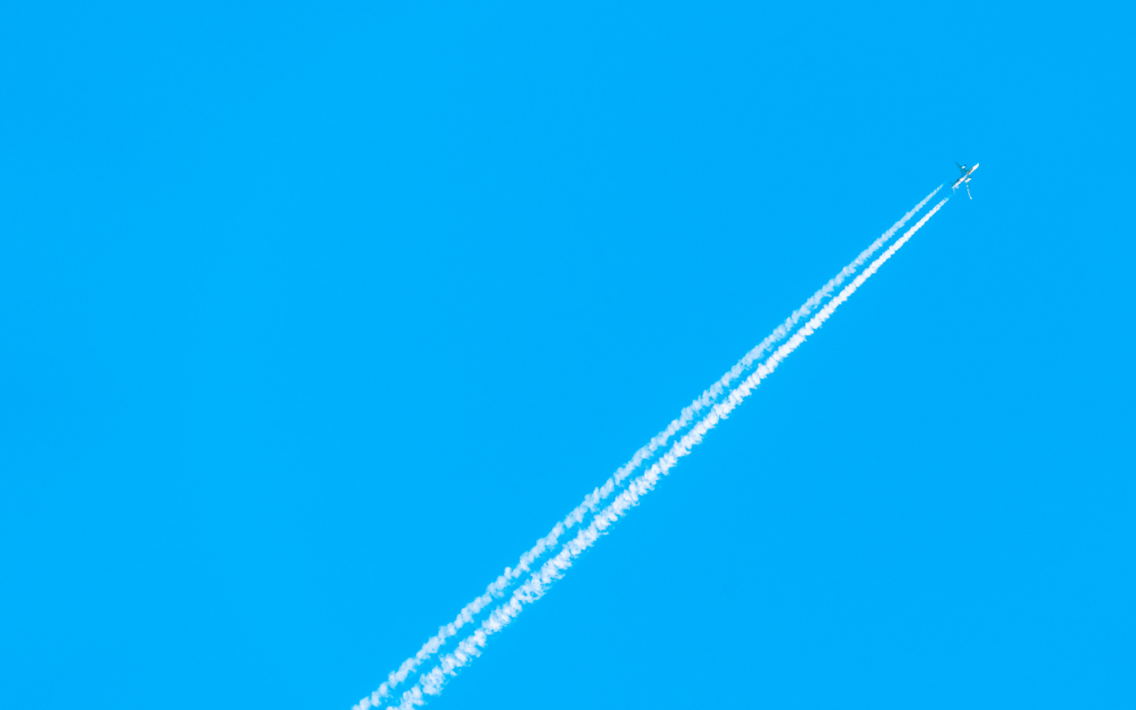 (Art of Scaling: IT for Tech Startups) airplane flying up in blue sky